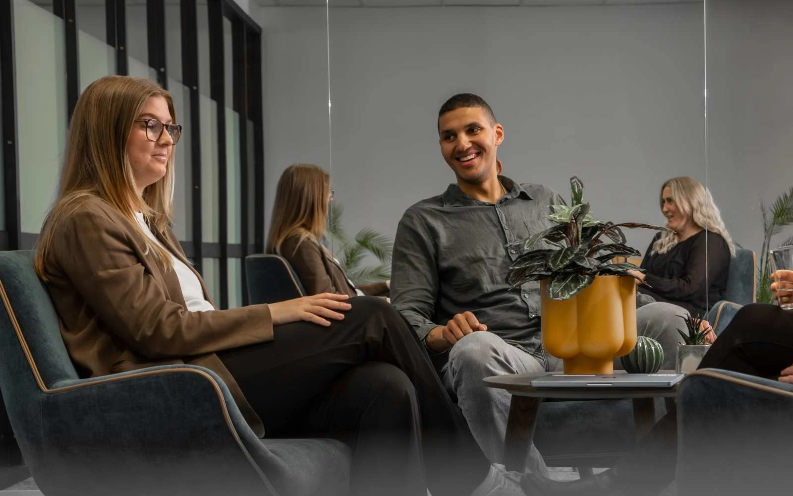 Certain Quality Management employees discussing