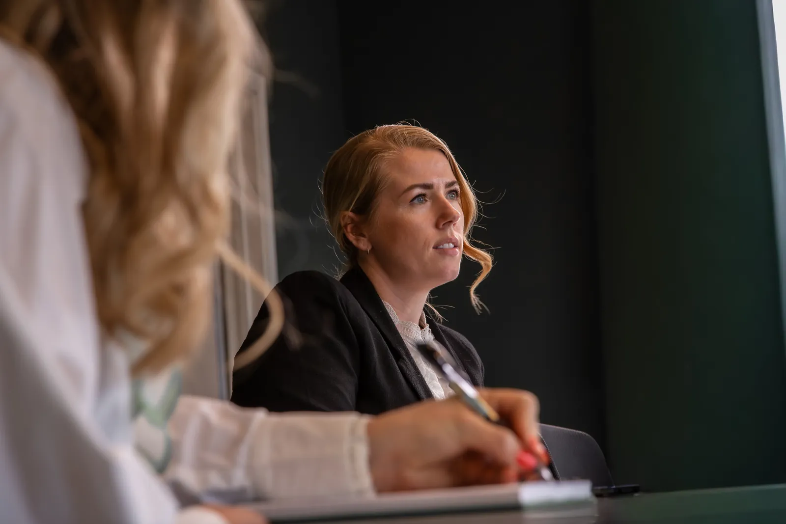 Certain QMS consultant listening in a customer meeting